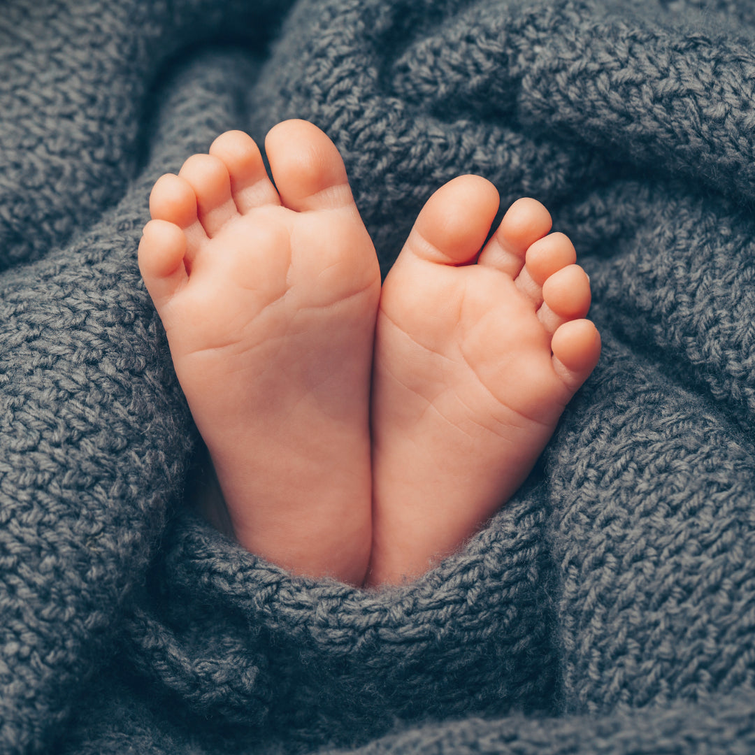 Baby feet in a blanket