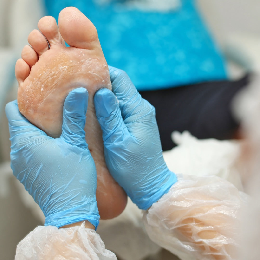 Podiatrist holding a foot in her hands